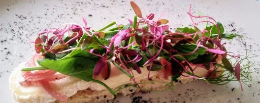 smoked leek with goats’ cheese, flowers, herbs, pickled onion and sourdough
